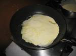 a crepe, being cooked